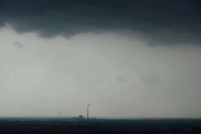 a sky view looking across the ocean at a ship in the distance