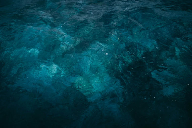 the water is deep and clear while the blue sky reflects in it