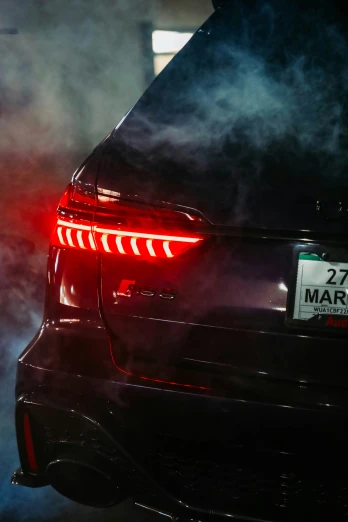a close up of the tail lights on a sports car