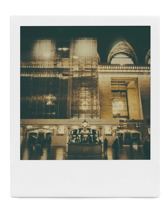 sepia po of train station and clock at night