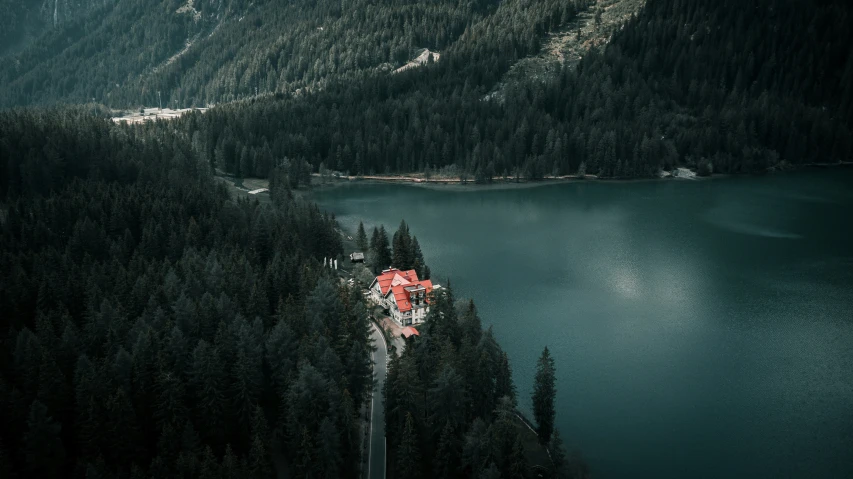 a beautiful building is next to a large lake