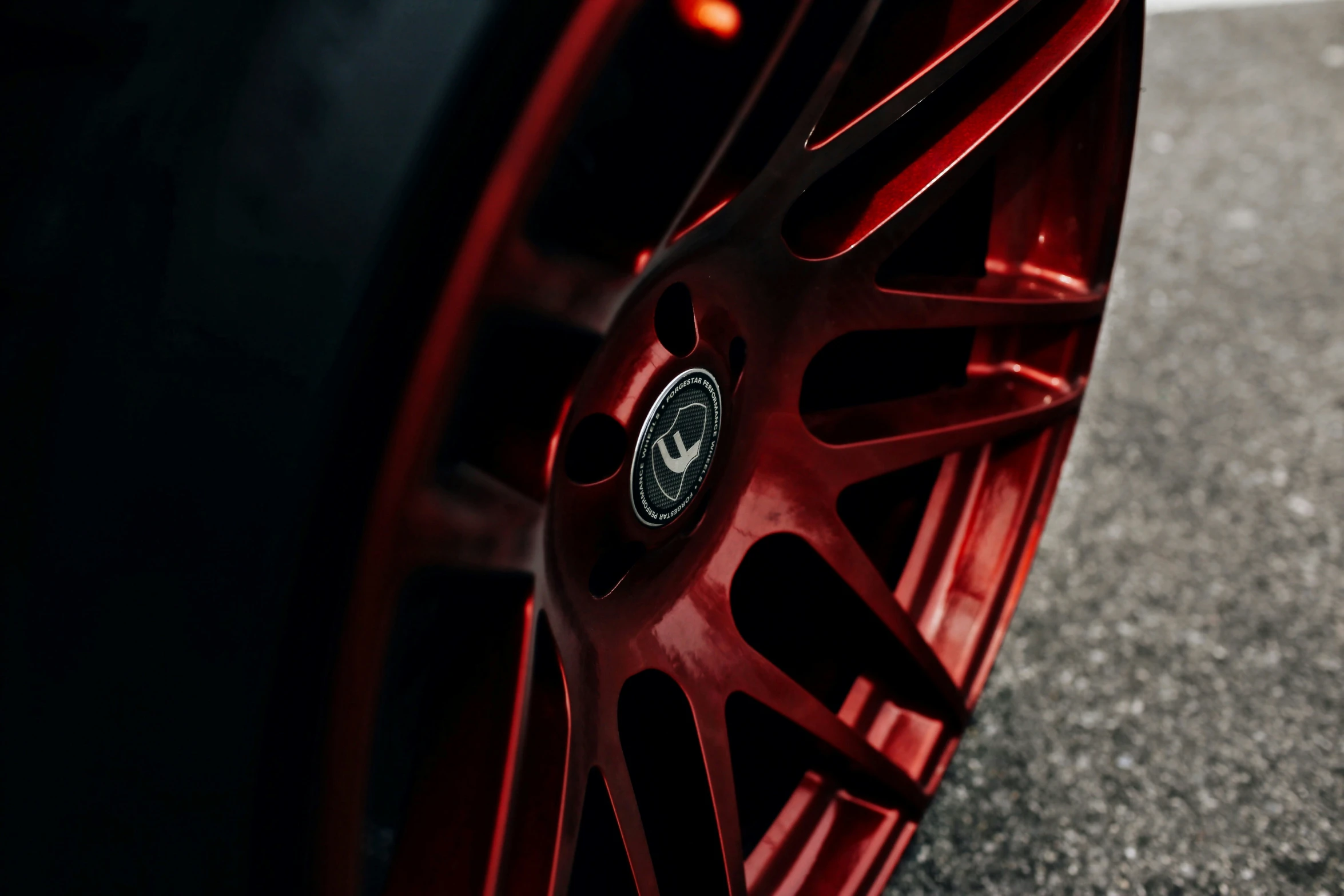 the rim of a car with red wheels