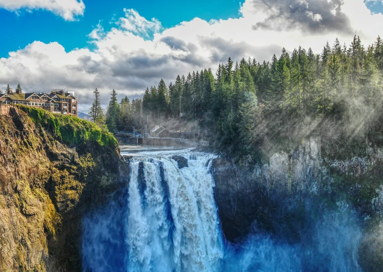 an image of water falling into a river with trees in the background