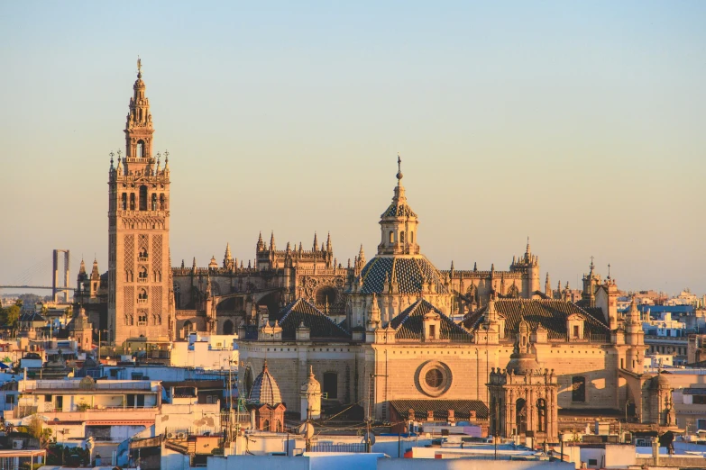 a very old city with towers in the middle of it