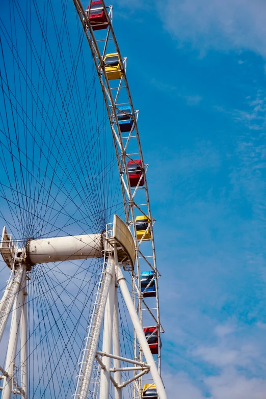 a large ferris wheel that has many colorful cars