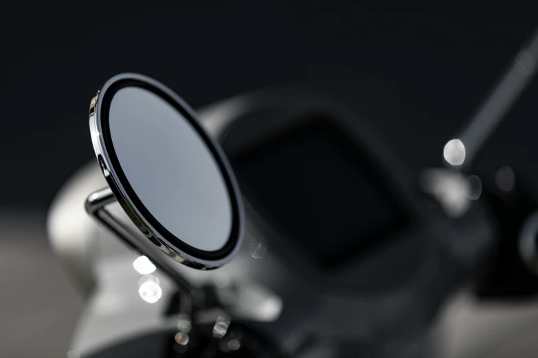 a motorcycle mirror with its reflection on the back of it