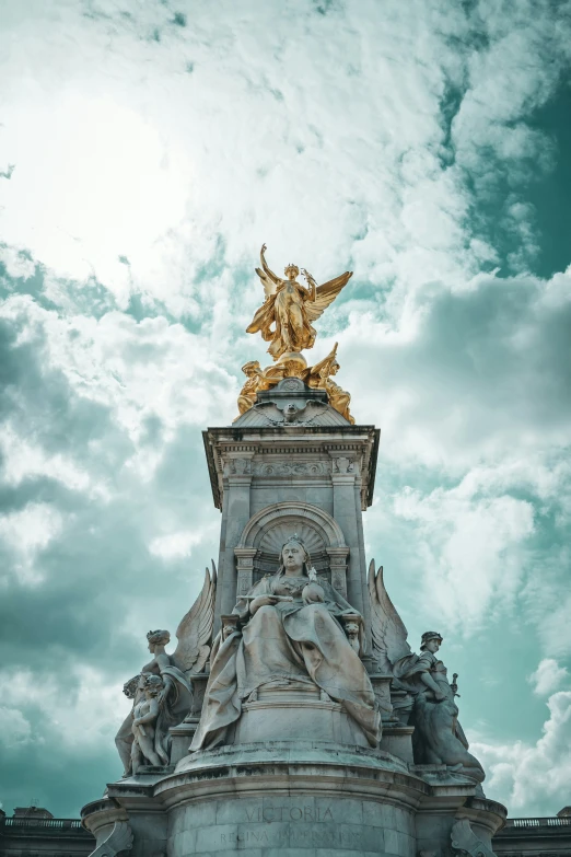 a statue that is standing in the middle of a field