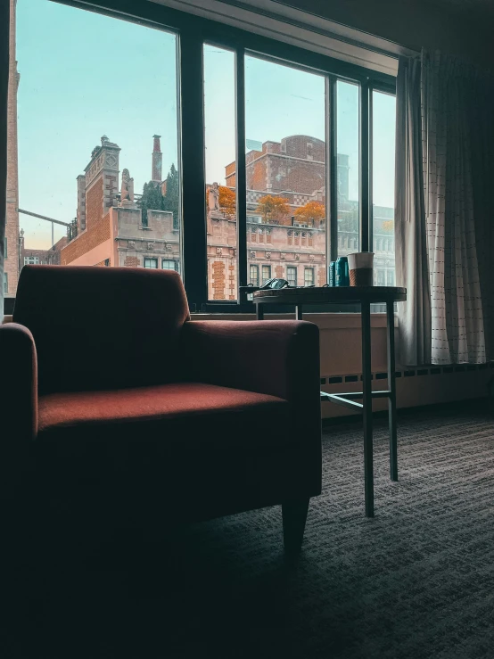 a living room filled with furniture and a window