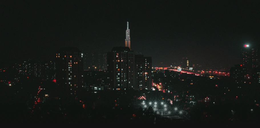 a nighttime view of a city with tall buildings