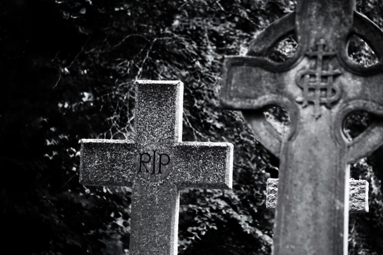 three graves with some very weird decorations on them