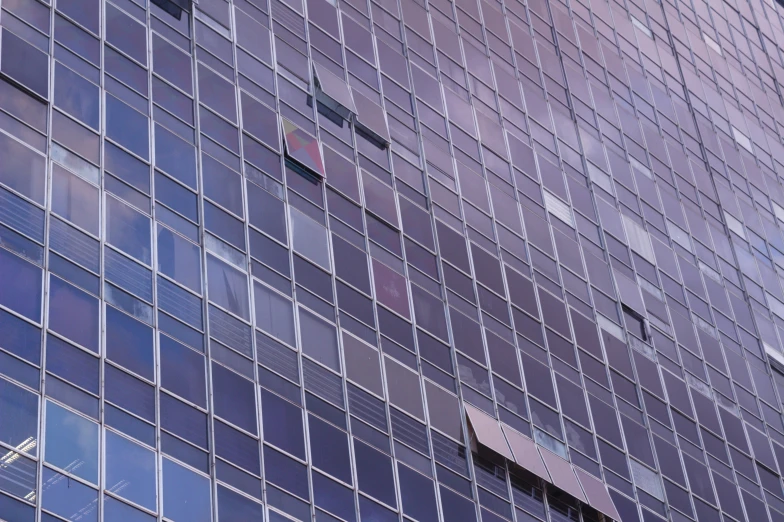 a very tall blue building with some windows