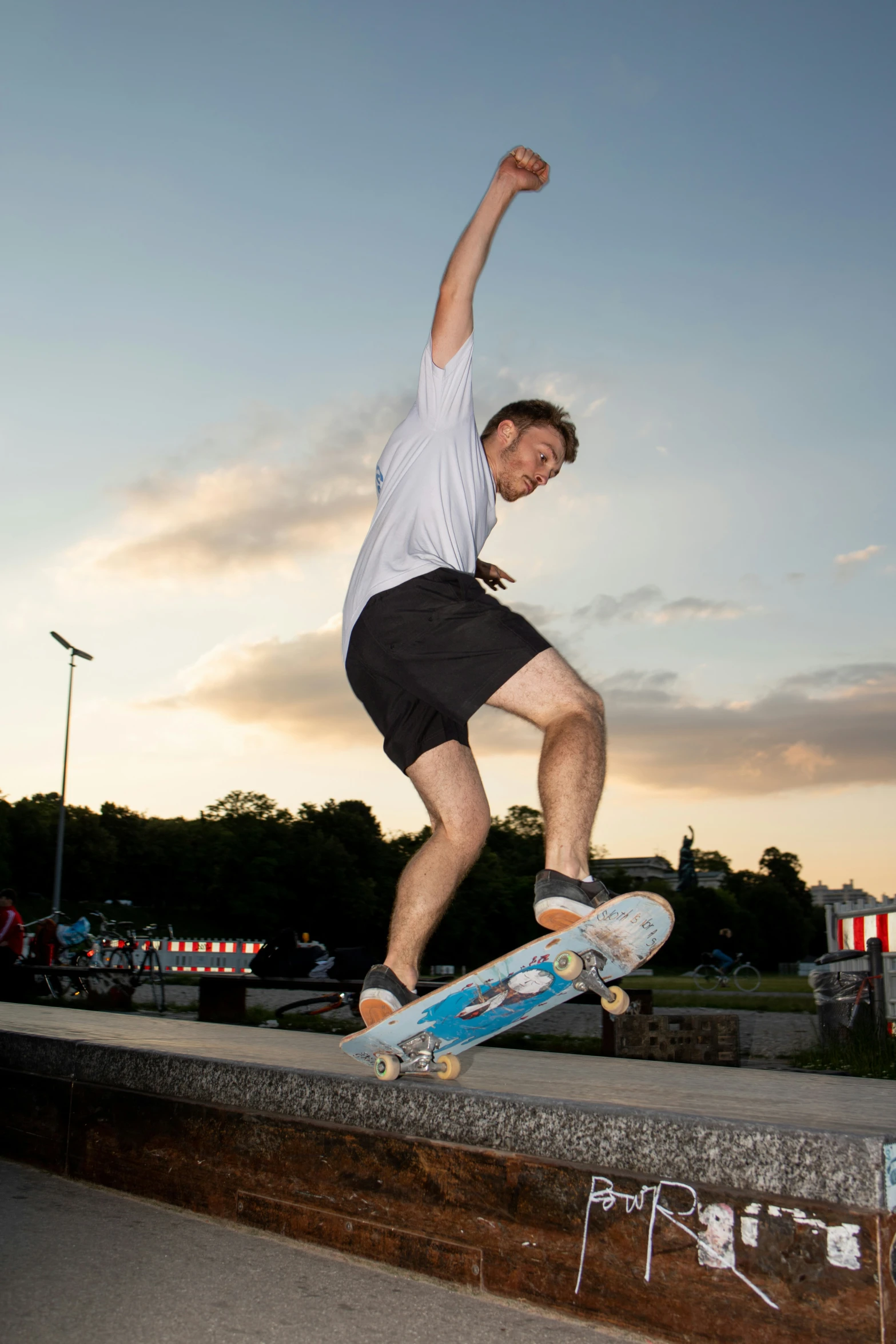 a man riding a skateboard up the side of a ramp