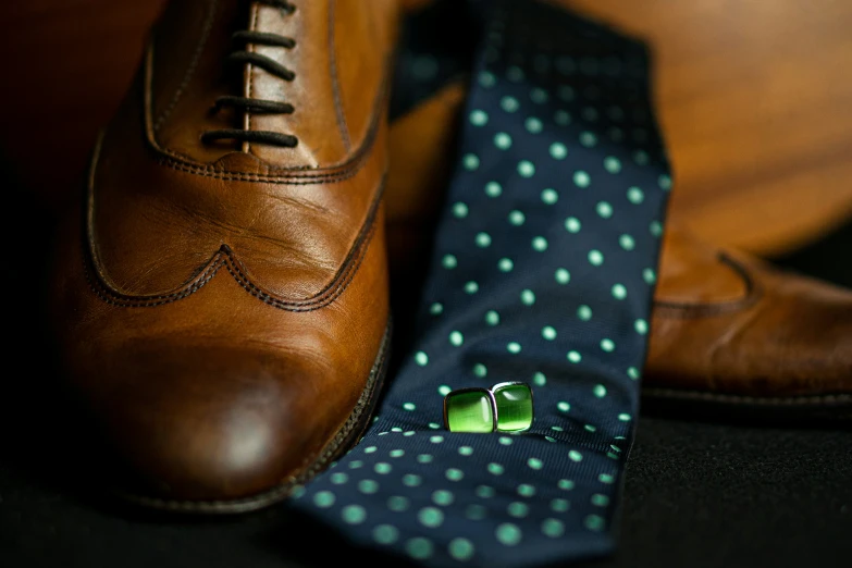 the tie has some blue dots on it