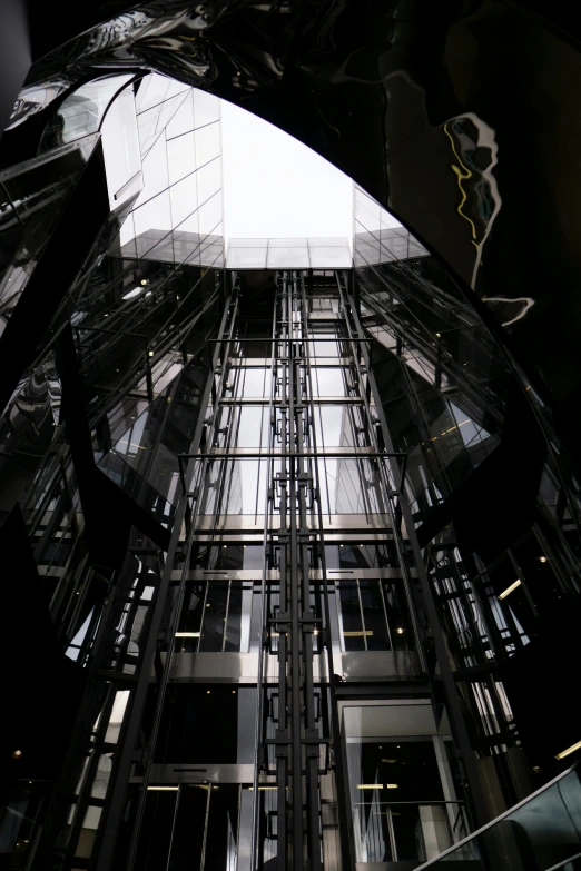 the entrance to a glass building in a city