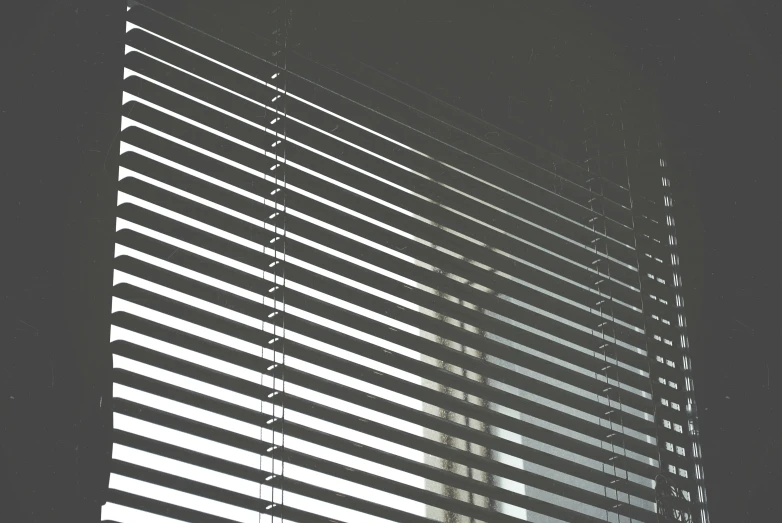 a close up s of the window blinds on an office building