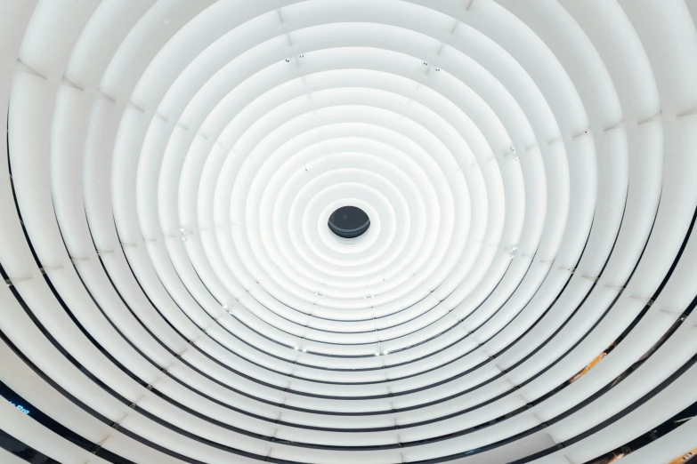 looking up at the inside of a white ceiling