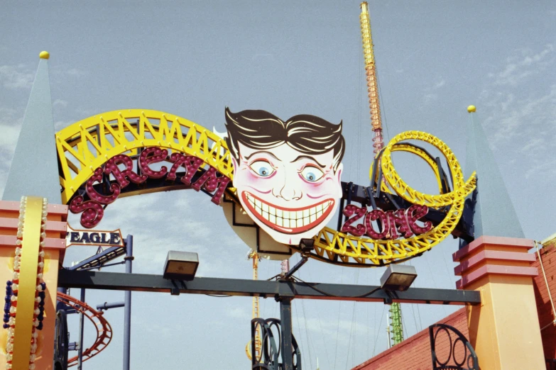an elaborate neon sign with a face and two large spirals