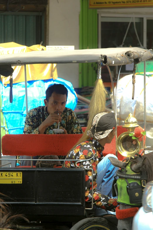 a man sitting in the back of a vehicle