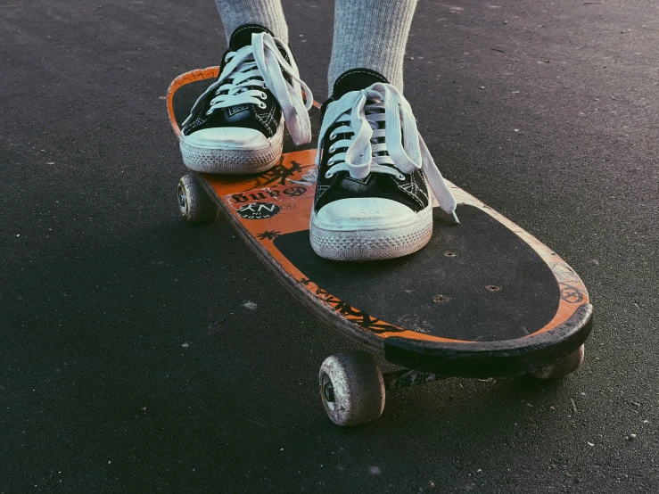 an adult on a skateboard on the pavement