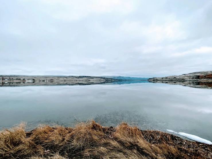 there is a large body of water and a mountain