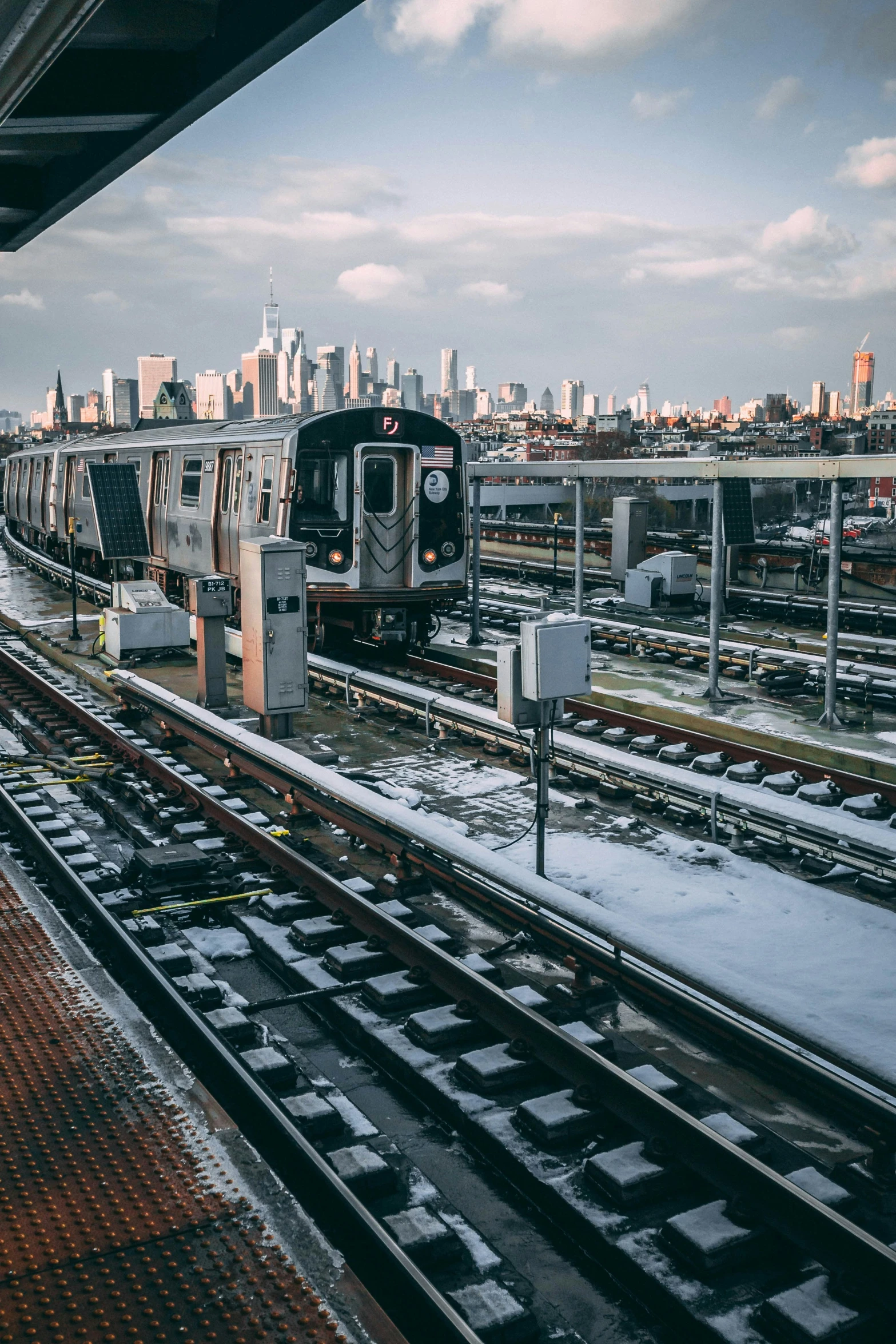 a train moving on tracks in a large city