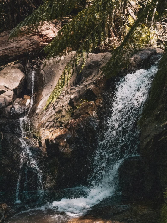 water coming down a very high, small waterfall