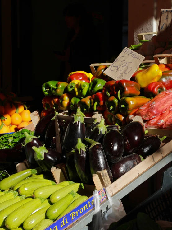 various fruits and vegetables sitting on display for sale