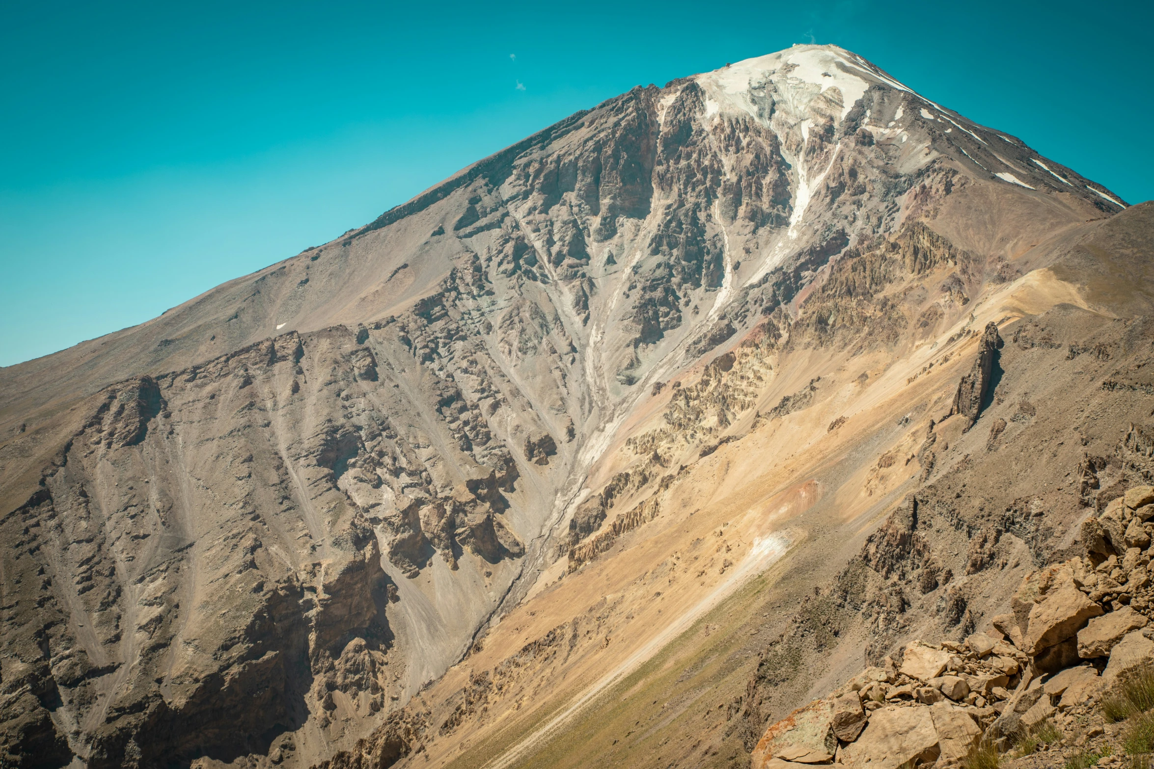 a hill side covered in rock and sand