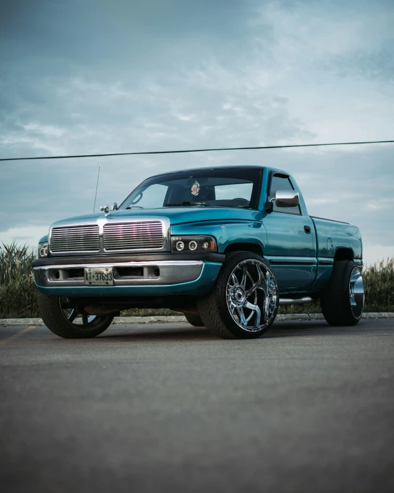 a big truck with a person sitting in the bed