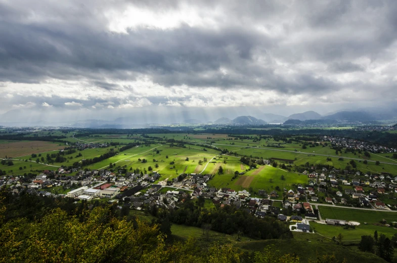 storm clouds over an entire town in the mountains