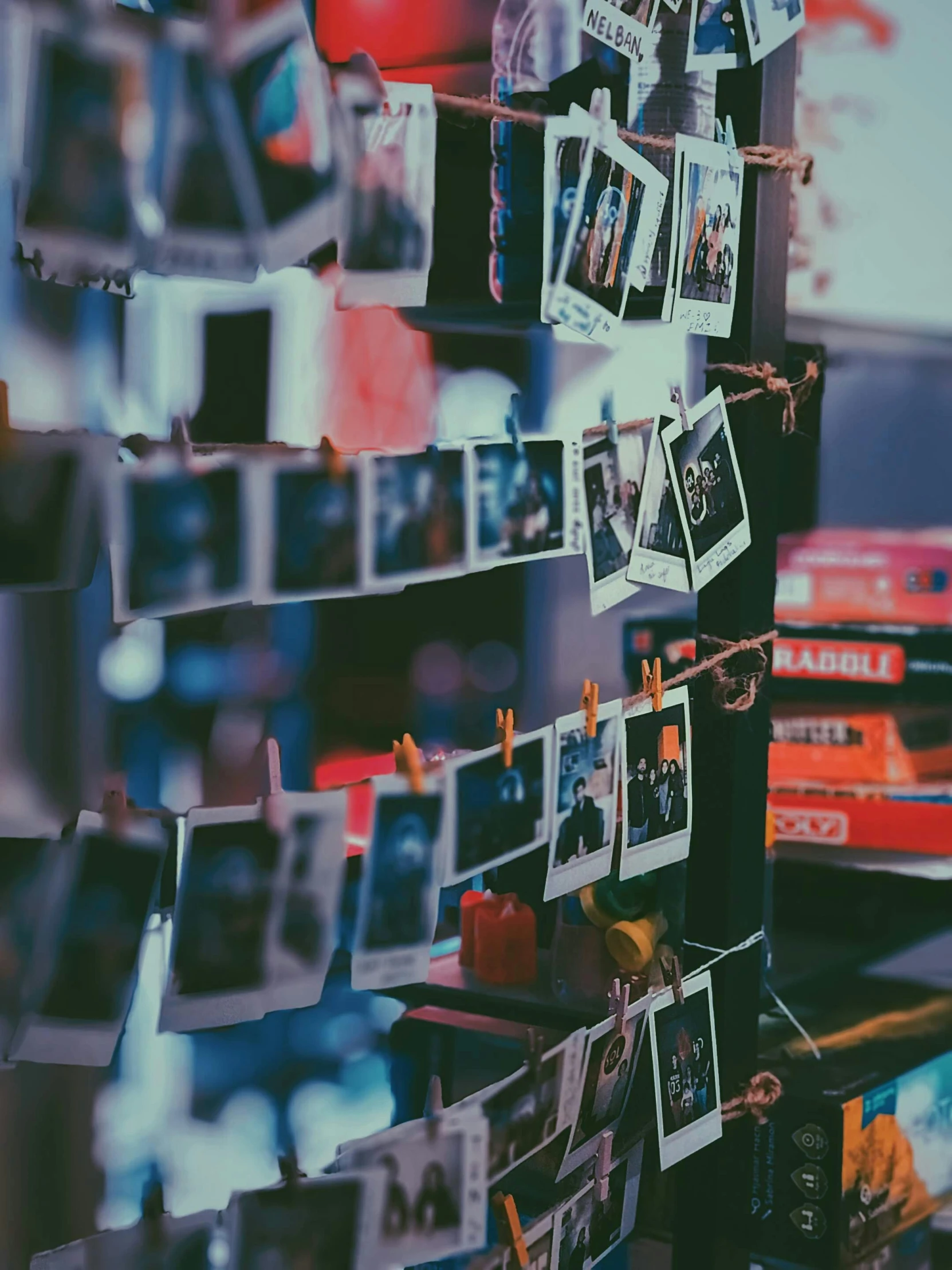 some pictures hanging on the wall on a rack