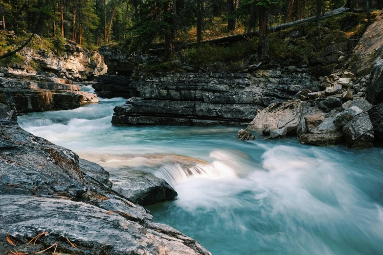 river with rushing water and rocks in the foreground