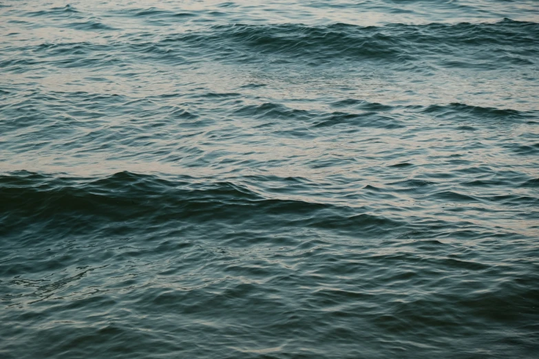 the waves come in to the beach shore