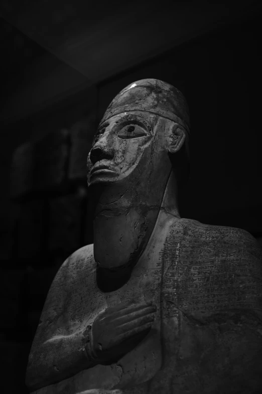 a statue of the god is shown in black and white