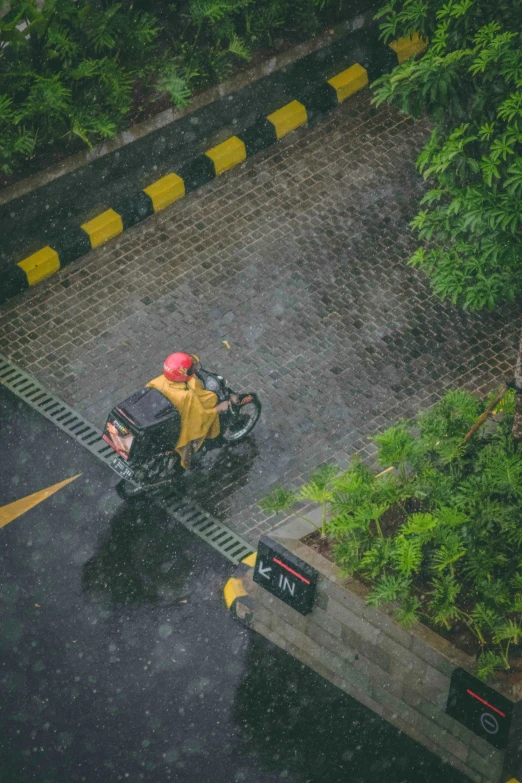 a man riding on the back of a motorcycle down a road