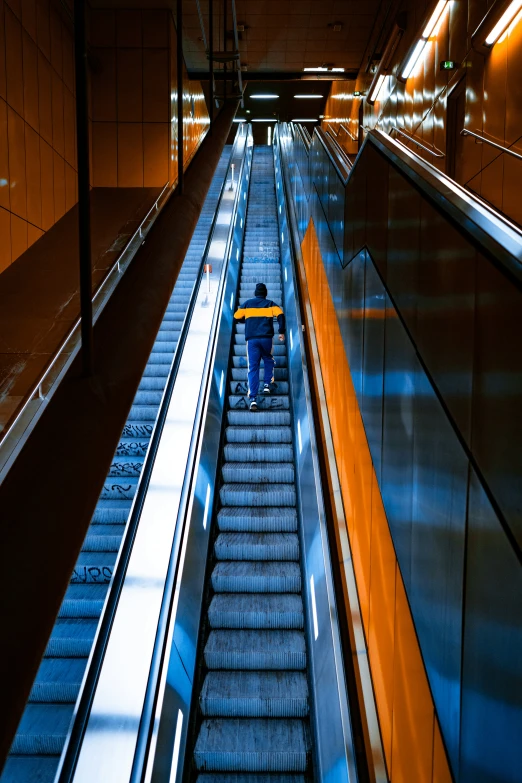 a person riding a cart down a large empty escalator