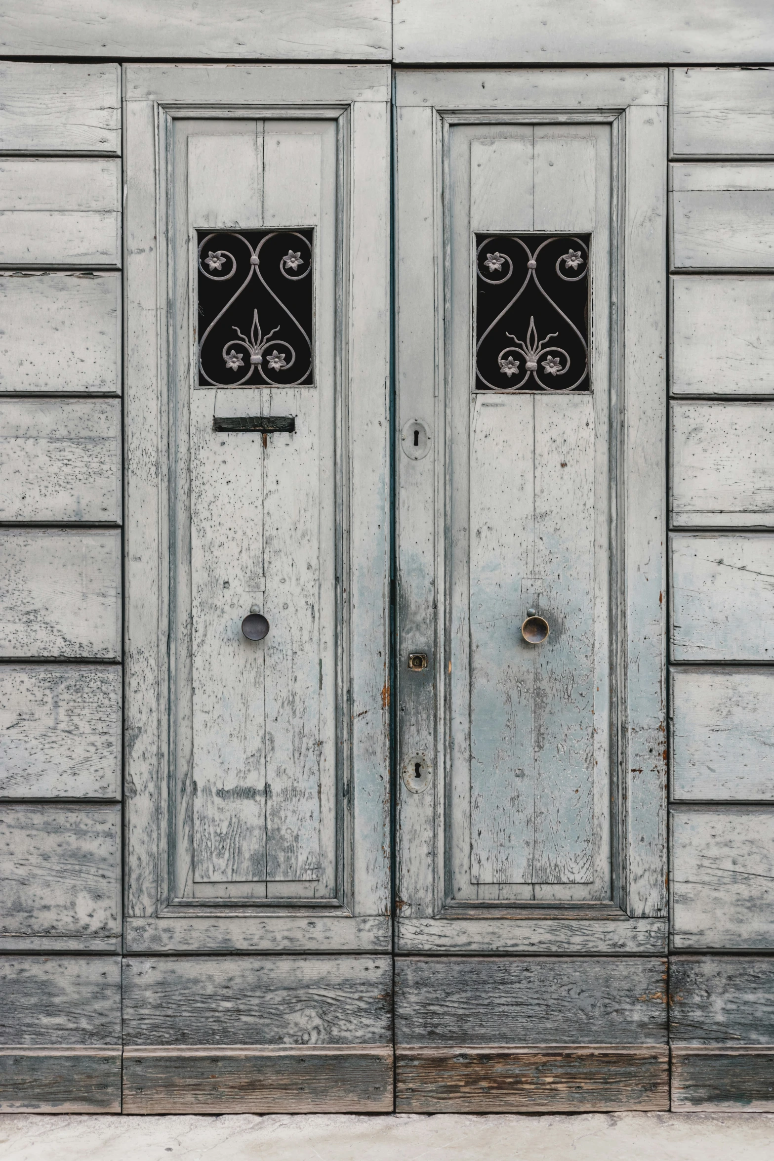 a white house with two double doors