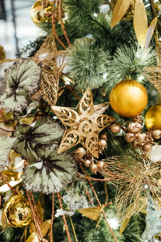 an assortment of decorations and ornaments decorates the top of a christmas tree