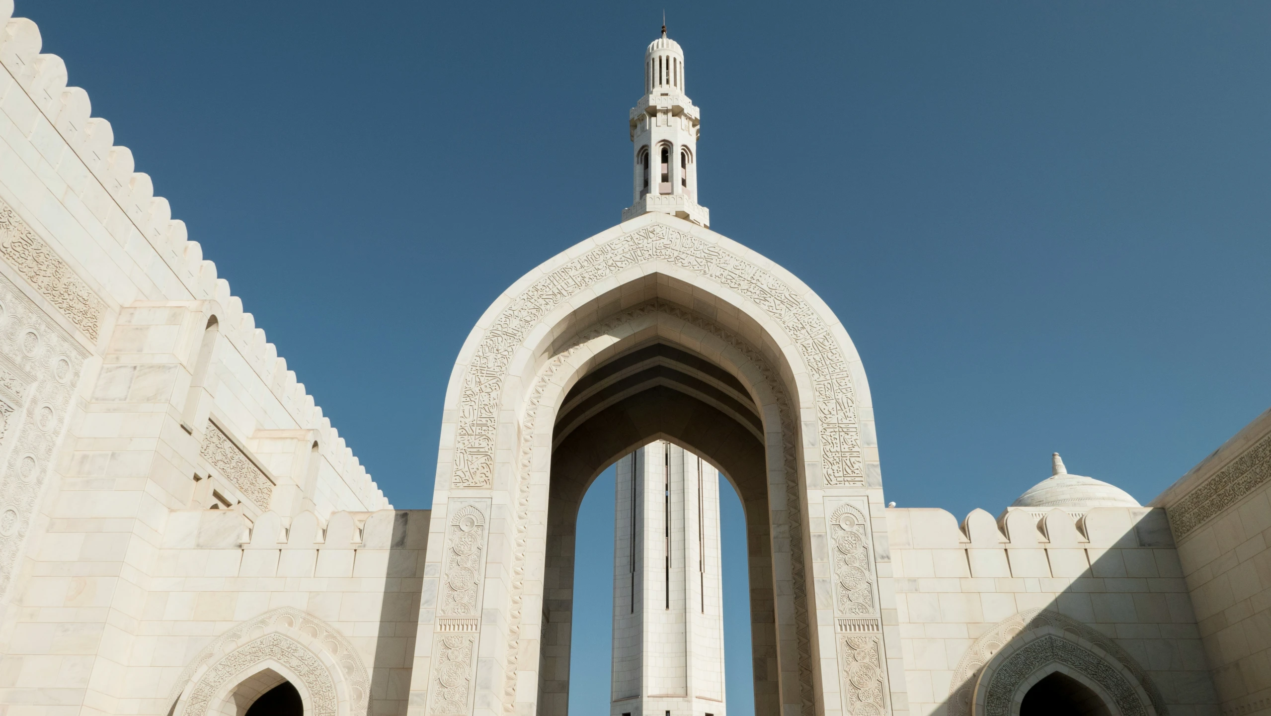 there is an archway that leads to the building