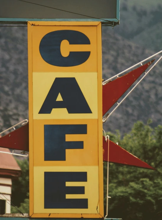 a big yellow sign on the side of a building