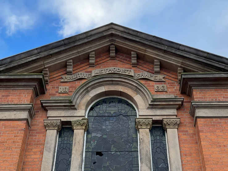 a closeup of an ornate stone and brick building