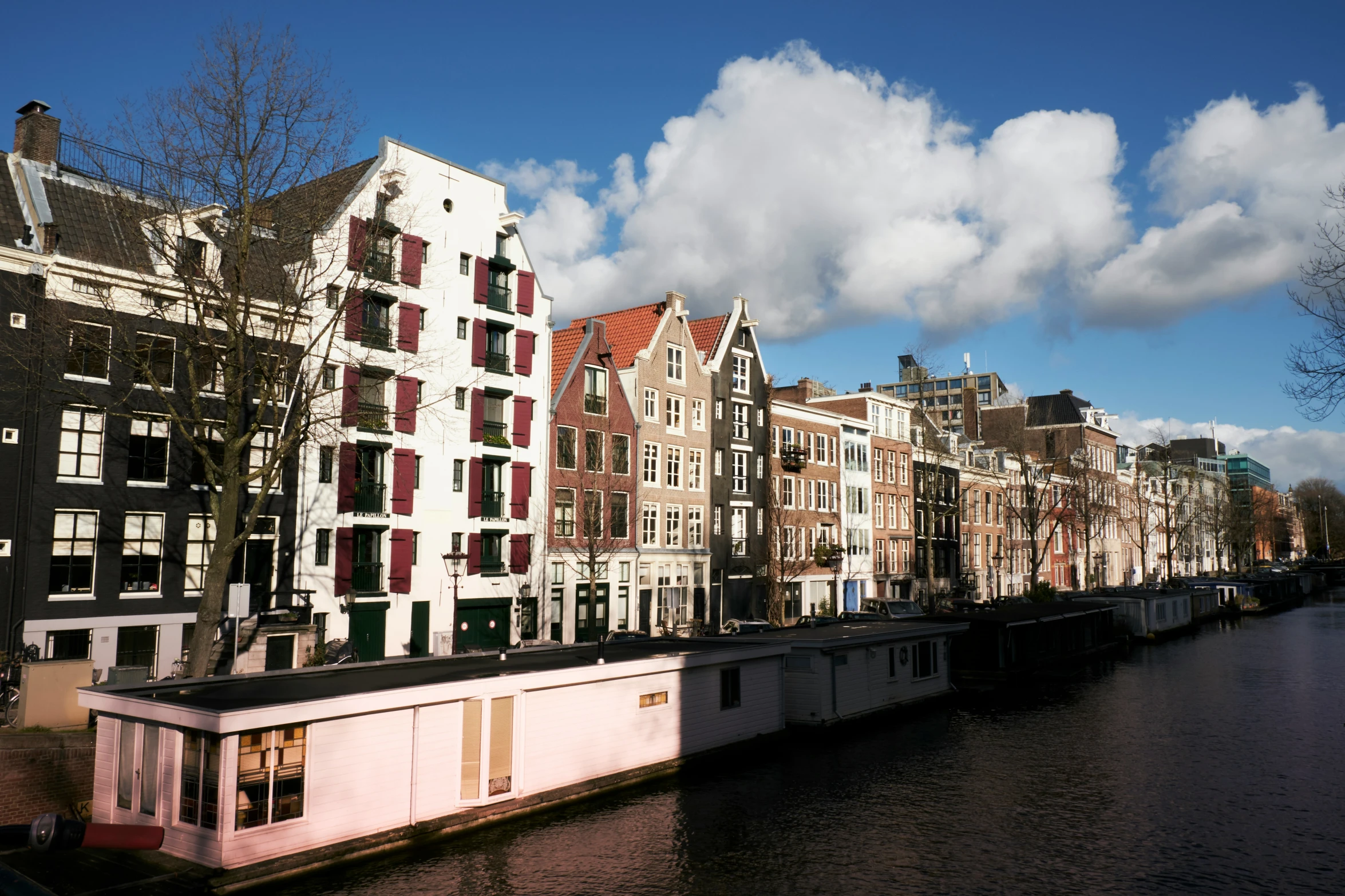 a line of houses along side a river