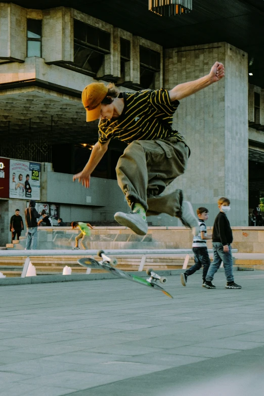 a man performing a skateboard trick on concrete