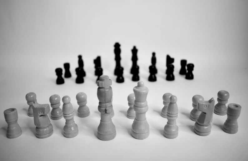a chess set with pieces laid out on the table