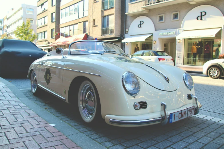 a classic car parked on the side of the road