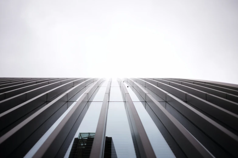 a very tall building with many windows and a sky line