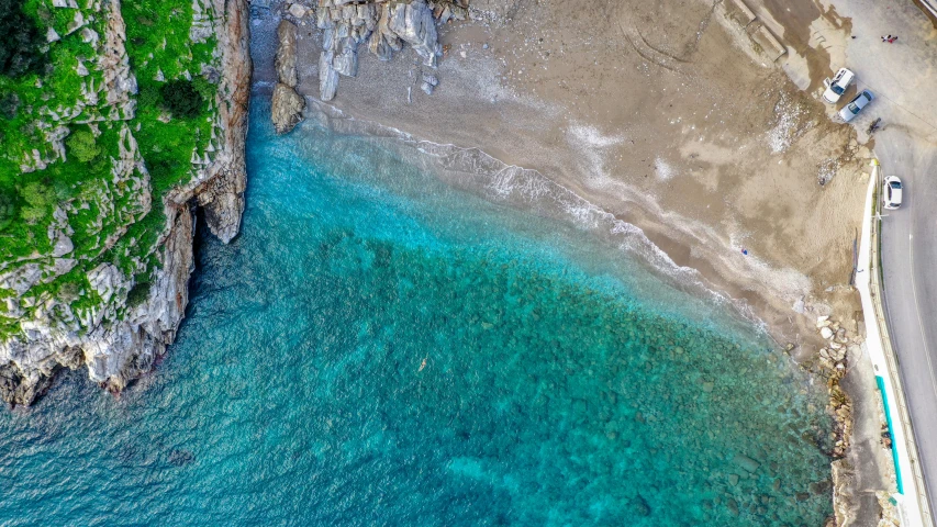 a beach in the middle of two steep cliffs