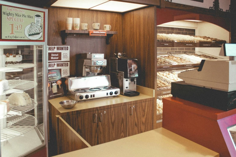 an open bakery with counter top and shelves