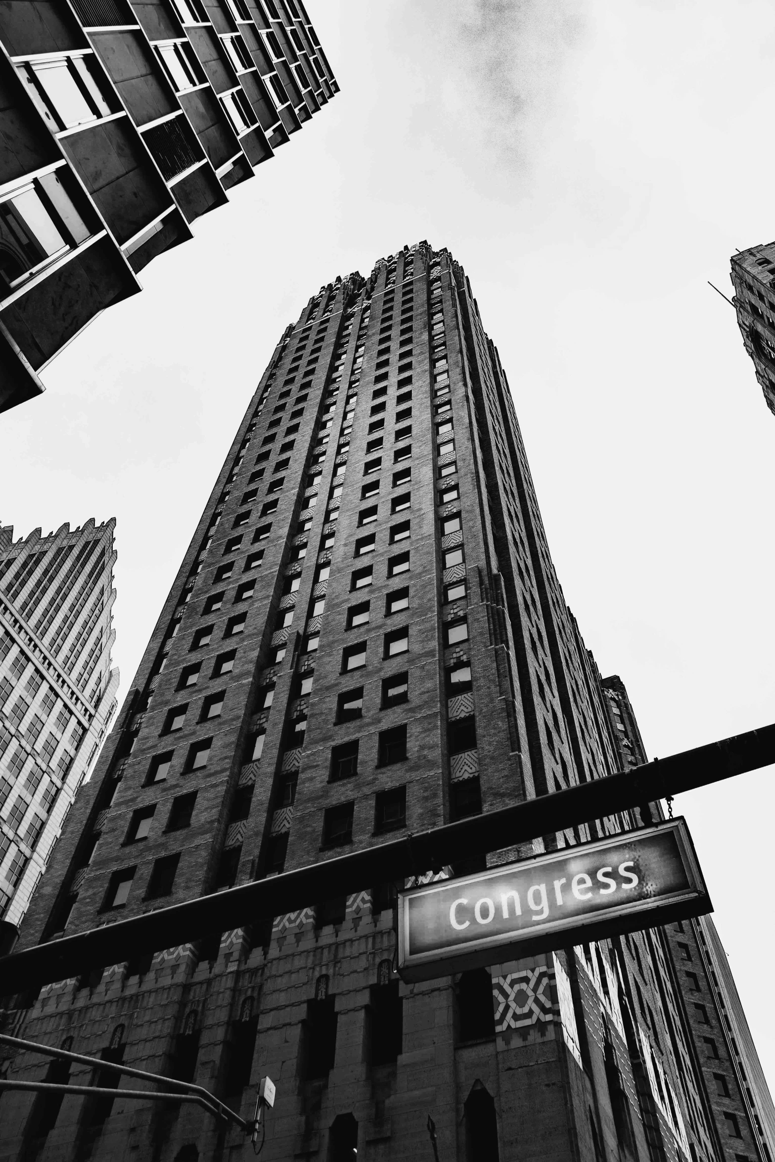 a black and white po of two tall buildings