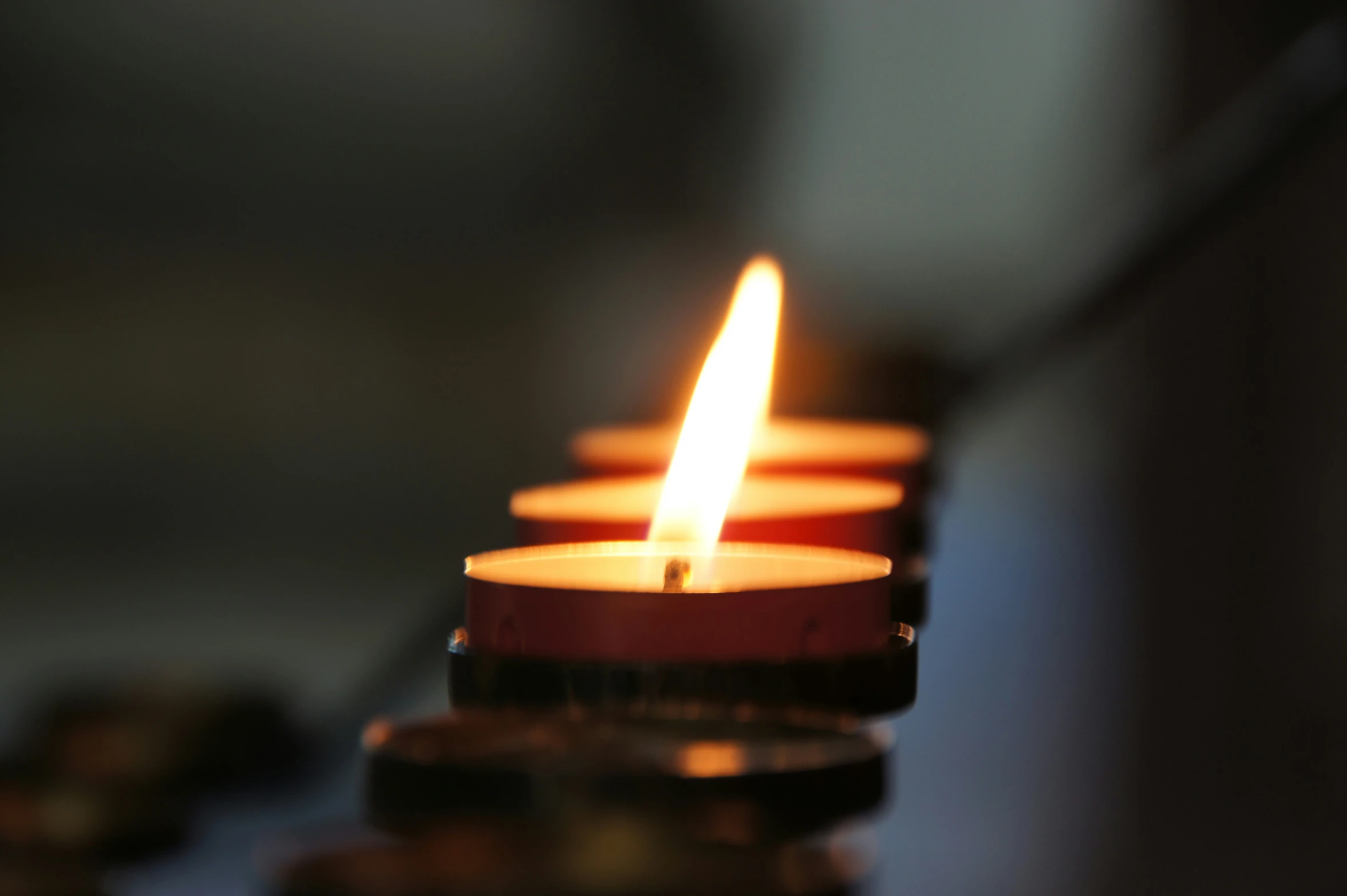 some candles on a table lit by a candlelight